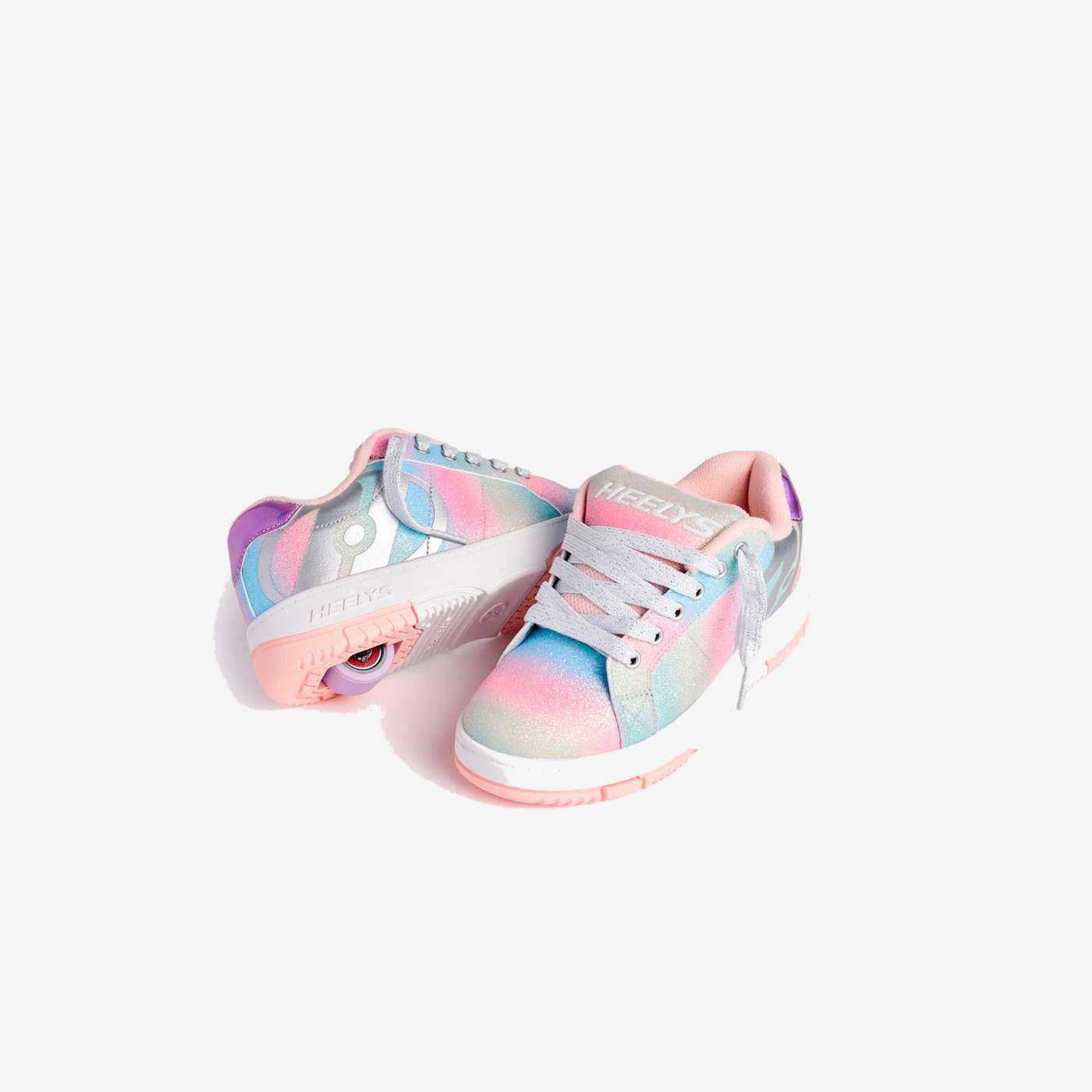 Heelys arcoíris para niña, con ruedas desmontables y diseño brillante. Comodidad, estilo y diversión que acompañan cada movimiento.