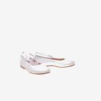 Merceditas de niña de piel nacarado en blanco con velcro.