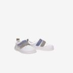Deportivos respetusos primeros pasos con velcro y puntera reforzada en blanco con tiras en azul y verde.