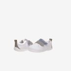 Deportivos respetusos primeros pasos con velcro y puntera reforzada en blanco con tiras en azul y verde.