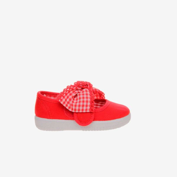 Mercedes de lona de niña en rojo con lazo.