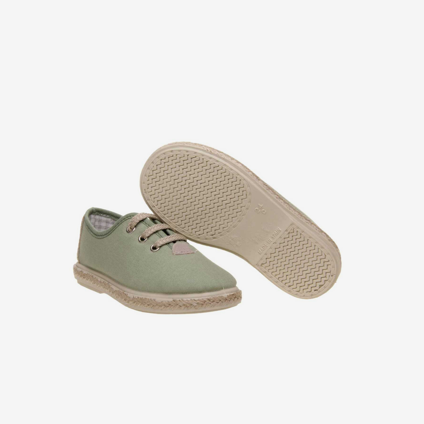 Lona de cordones de niño en color verde.