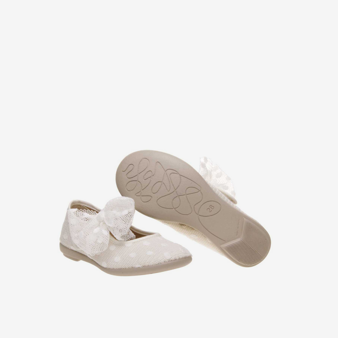 Merceditas de lona con encaje con lazo decorativo en color beige.