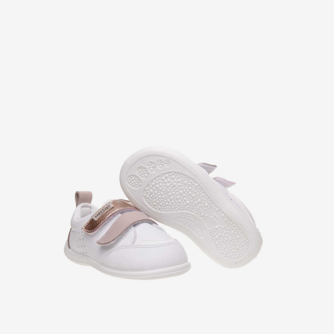 Deportivos respetuoso de niña con velcro y puntera reforzada en blanco y rosa.