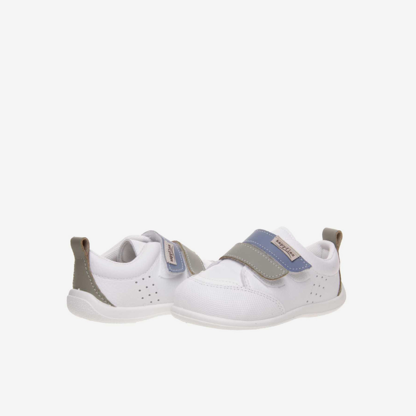 Deportivos respetusos primeros pasos con velcro y puntera reforzada en blanco con tiras en azul y verde.